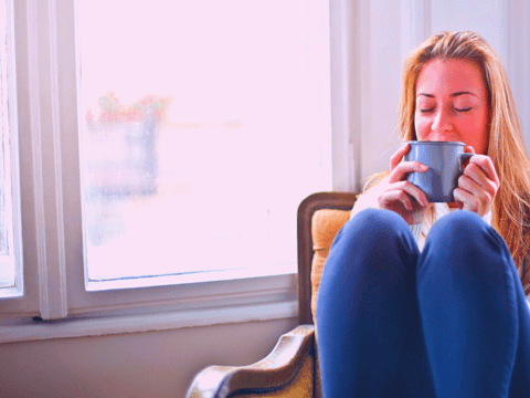 Woman drinking warm drink