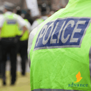 back of a police officers Hi-Vis jacket. it reads 'police'